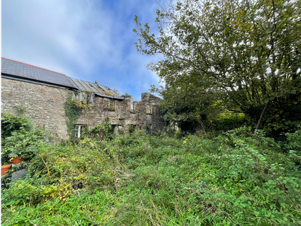 A pair of derelict cottages with planning permission set in 1.1 acres